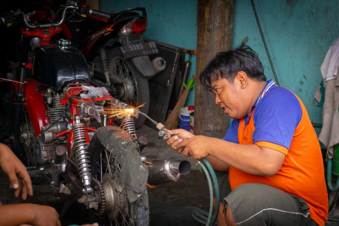 man holding welding torch